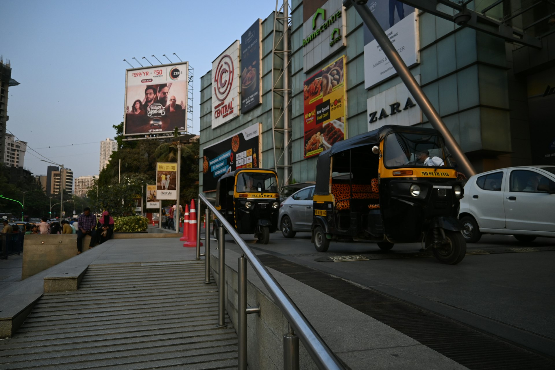 a row of parked cars on a city street